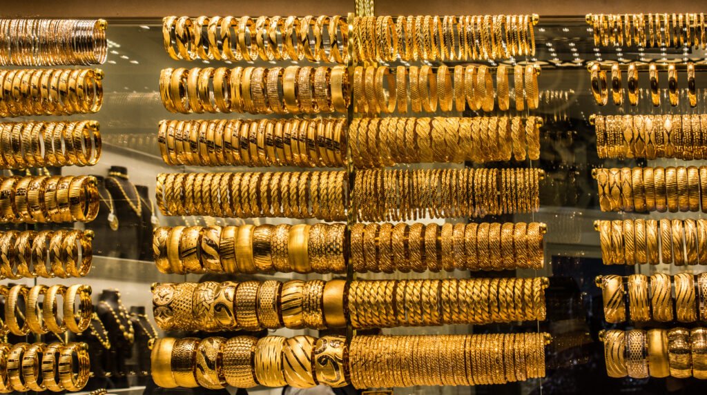 shop display of dozens of golden bracelets shop display of dozens of golden bracelets